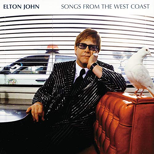 Elton John album cover featuring him with a dove and city background.