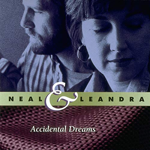 Close-up of a man and woman with a blue tint, titled Neal & Leandra.