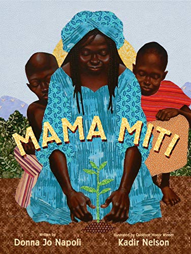 A woman in a blue headwrap and dress plants a seedling with two children.
