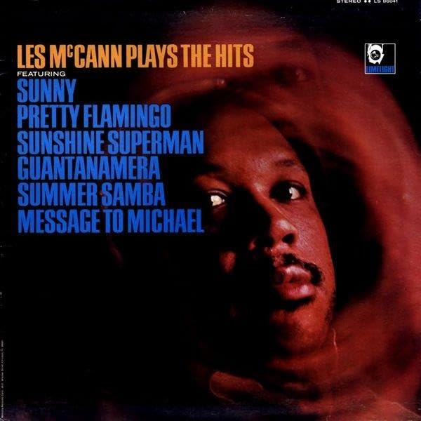 Album cover for Les McCann’s “Plays The Hits” featuring a portrait.