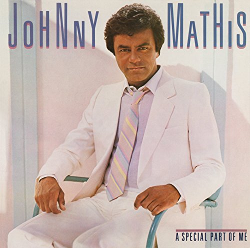 Johnny Mathis album cover, portrait of singer in a white suit.