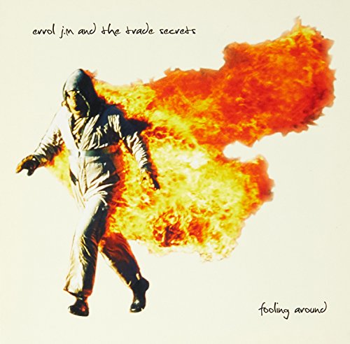 CD cover: person in suit walking amidst a fiery explosion.