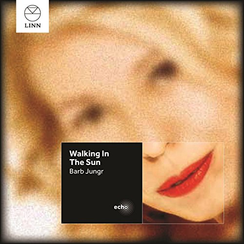 CD cover with a blurred face and red lips, titled "Walking In The Sun".