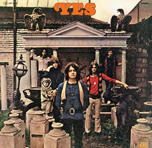 Yes album cover featuring five men posing in front of a classical structure.