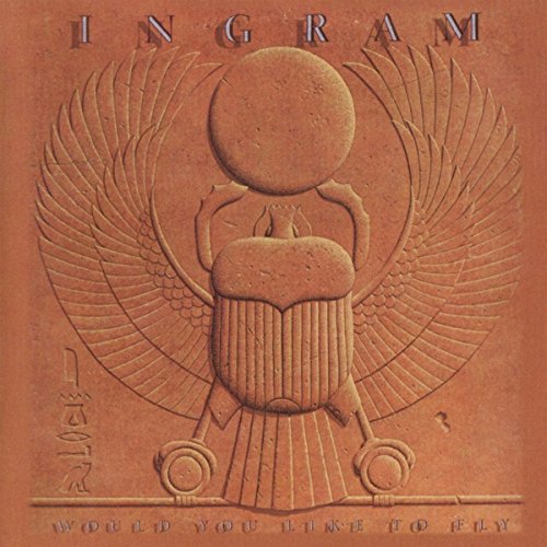 CD cover with a sculpted scarab beetle and outstretched wings.