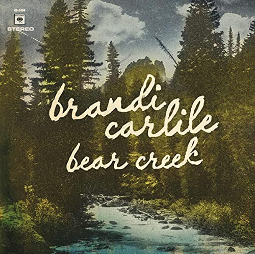 CD cover for Brandi Carlile’s “Bear Creek” with forest and river imagery.