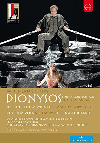DVD cover for Wolfgang Rihm’s *Dionysos* opera, featuring performers on a rocky set.