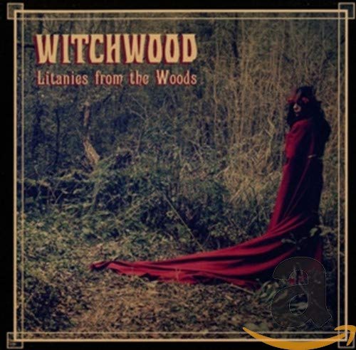 CD cover: woman in red dress standing in a dense forest.