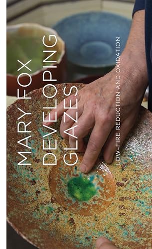 Book cover featuring pottery with colorful glazes and a hand.