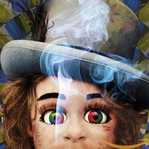 CD cover: person with colorful eyes under a hat, smoke effects.