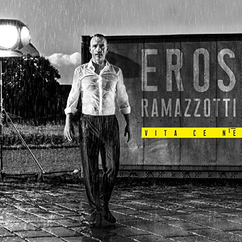 Eros Ramazzotti album cover, black and white with yellow text, rainy scene.