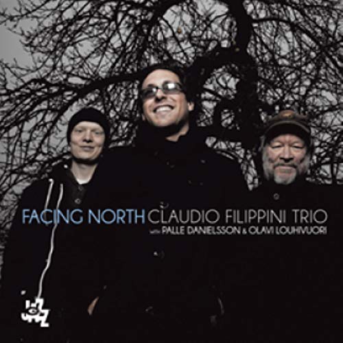 CD cover featuring three men against a stark, wintry tree background.