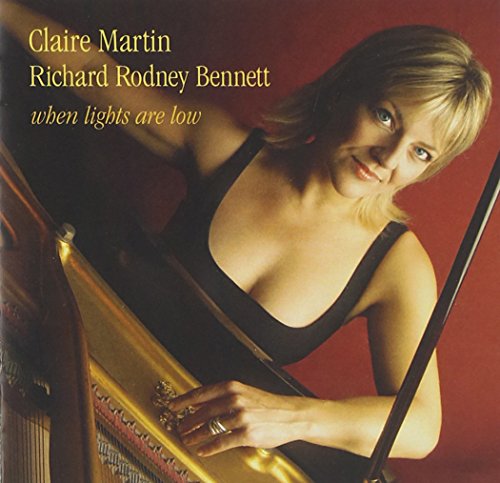 Claire Martin with a harp, album cover for “When Lights Are Low”.