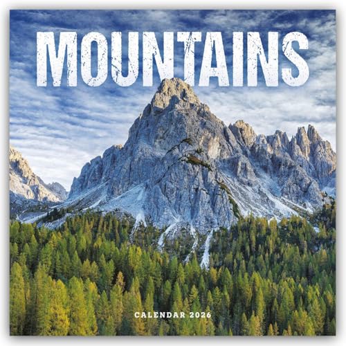 Snow-capped mountains rise above a dense evergreen forest, 2026 calendar.