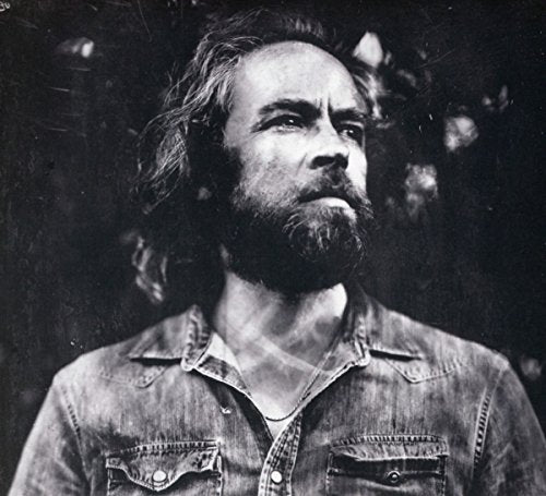 Black and white portrait of Duke Garwood, a man with long hair and beard.