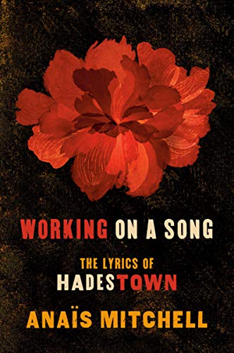Book with lyrics and likely related to the musical Hadestown, with a plain cover.