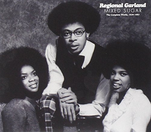Black and white portrait of three people with afro hairstyles.