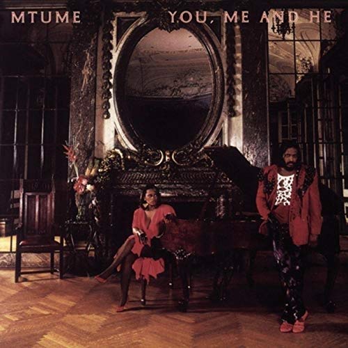Album cover for Mtume’s “You, Me And He” featuring two people in a grand room.