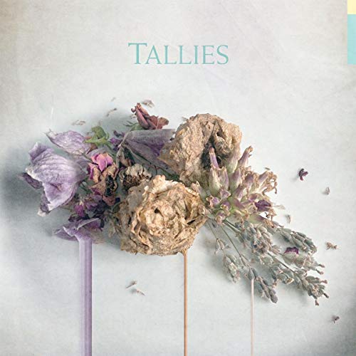 CD cover with dried flowers arranged against a pale background.