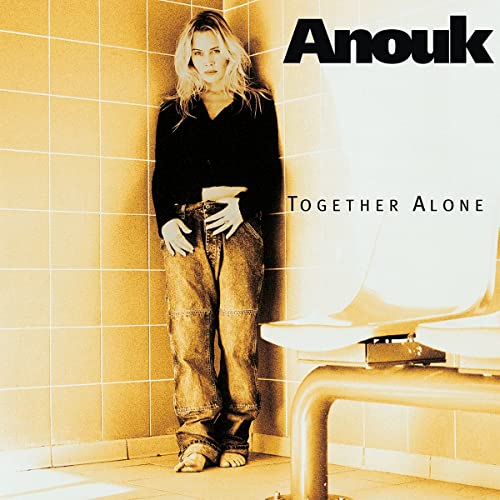 Album cover for Anouk’s “Together Alone” featuring a woman in a bathroom.