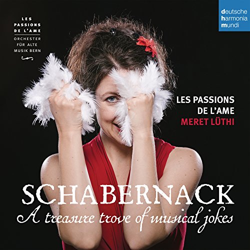 CD cover: woman in red playfully covered with white feathers.