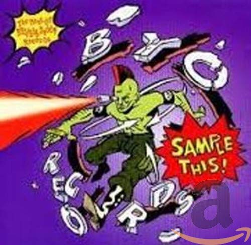 CD cover: cartoon green figure with mohawk shooting a red beam.