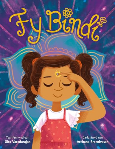 Small bindi sticker or patch with design, likely circular, on backing material.