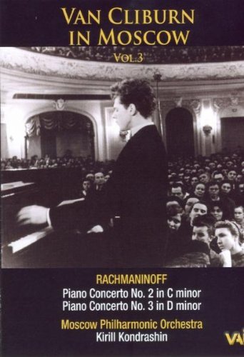 Van Cliburn at a piano in a concert hall, DVD cover.