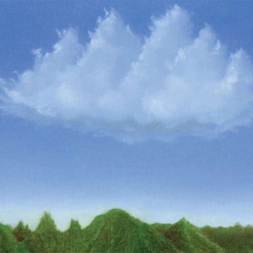 Blue sky with fluffy white clouds over a green, hilly landscape.