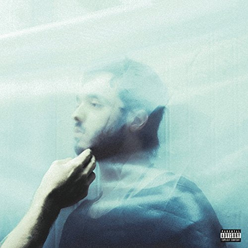 Blue-toned album cover featuring a man’s blurred face and hand.