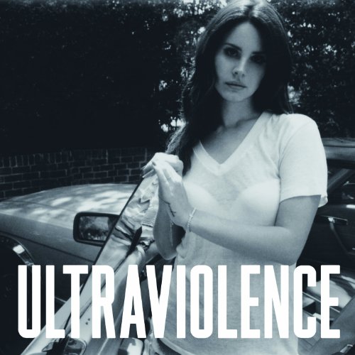 Black and white portrait of Lana Del Rey leaning on a car.