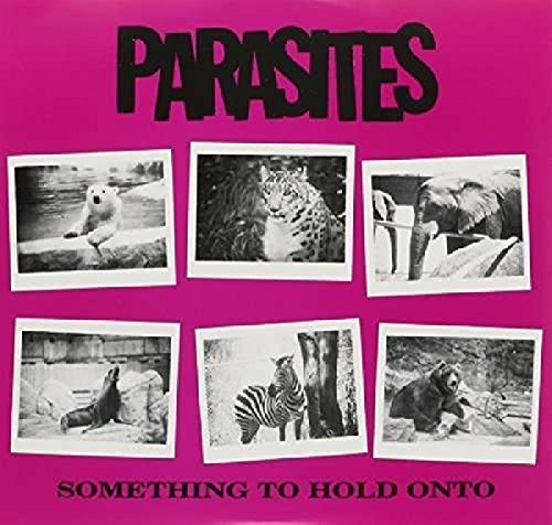 Pink album cover with black text and six black and white animal photos.