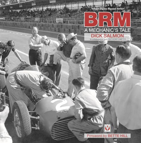 Black and white photo of mechanics and a vintage racing car.