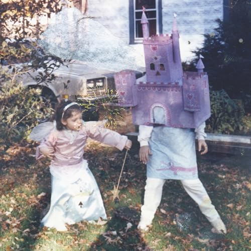 Two children in homemade costumes—a princess and a castle—pose outdoors.