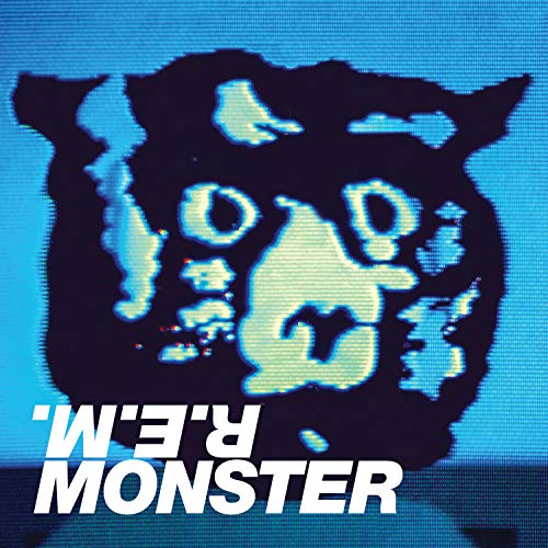 R.E.M. “Monster” CD cover: distorted black shape on blue with white text.