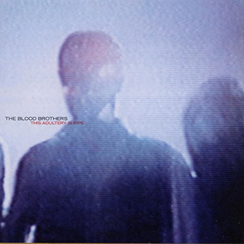 CD cover for Blood Brothers, featuring a blurred figure in blue tones.