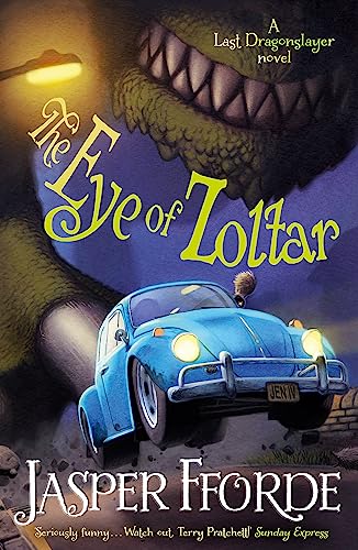 A blue car drives beneath the giant, toothy mouth of a monster at night.
