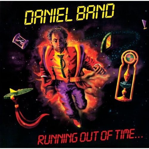 Album cover: man in suit amidst cosmic imagery and clocks.