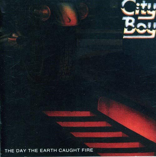 CD cover for "City Boy - The Day The Earth Caught Fire", dark tones.