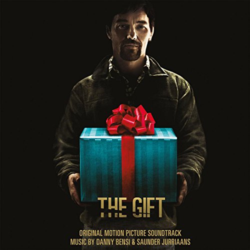 Movie poster for "The Gift" soundtrack featuring a man holding a gift.