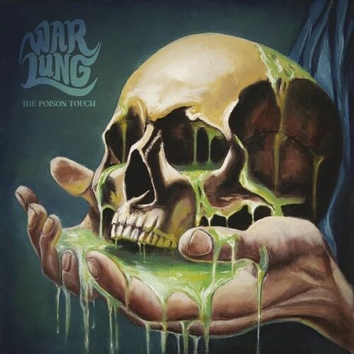 Painted skull with dripping green substance held in a hand.