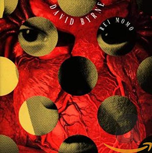 David Byrne’s “Rei Momo” CD cover with eyes and circular patterns.