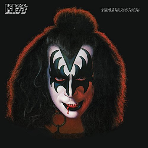 Gene Simmons of KISS with demon face paint and long black hair.