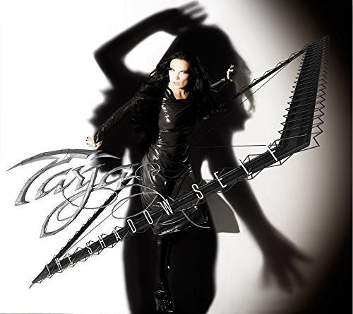 Tarja Turunen album cover, woman in black with large harp-like instrument.
