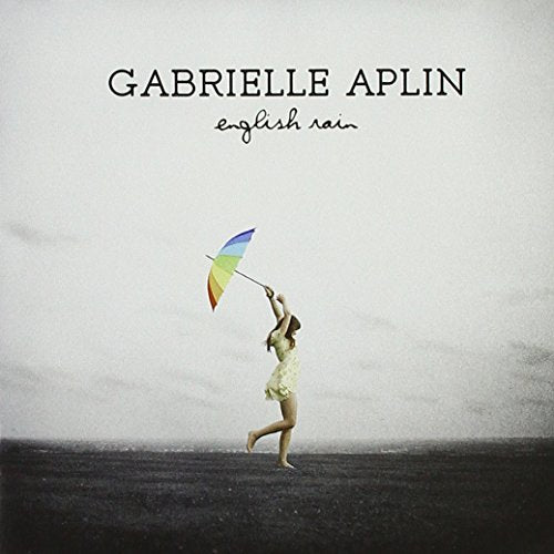 CD cover: girl with rainbow umbrella in a grey landscape.