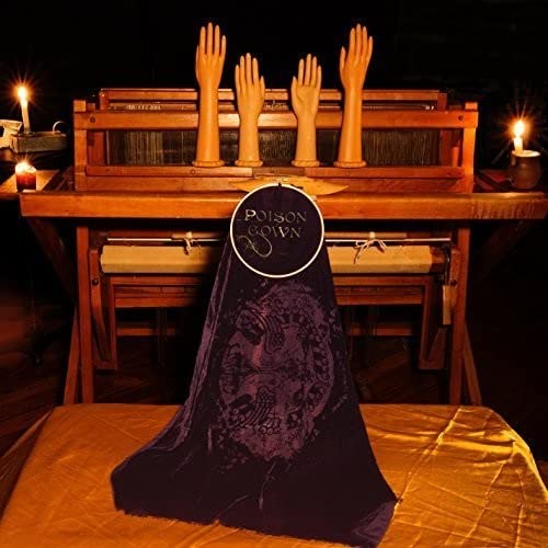 CD cover with hands, piano, and a dark, patterned purple gown.