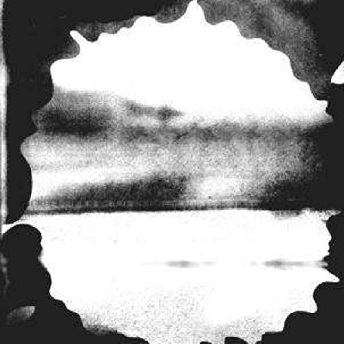 Black and white abstract landscape framed by dark, blurred edges.
