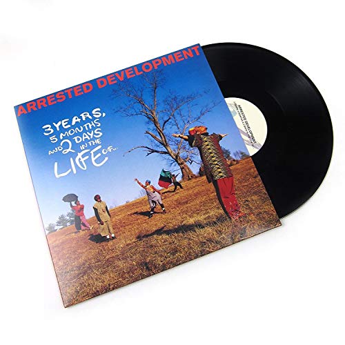 Arrested Development" vinyl record with album art depicting a group in a field.