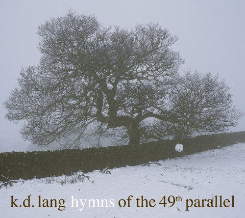 CD cover: winter landscape with a bare tree and stone wall.