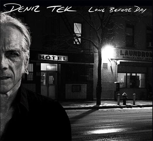 Black and white CD cover featuring a man and a city street scene.